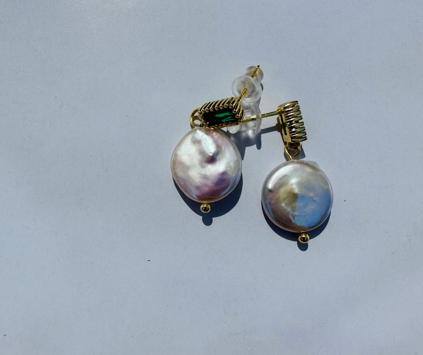 Pearl earring with green stone